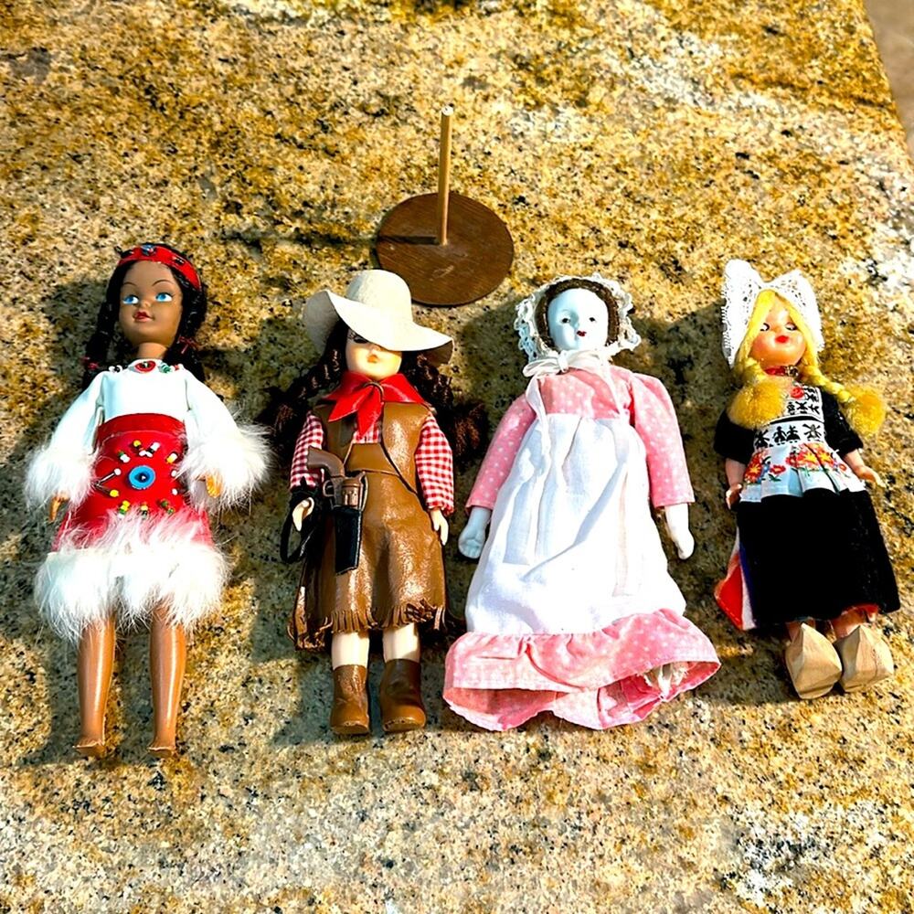 Vtg lot of assorted dolls & 1 wooden‎ stand